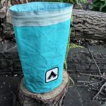 Large cylindrical drawstring bag made from an old tent